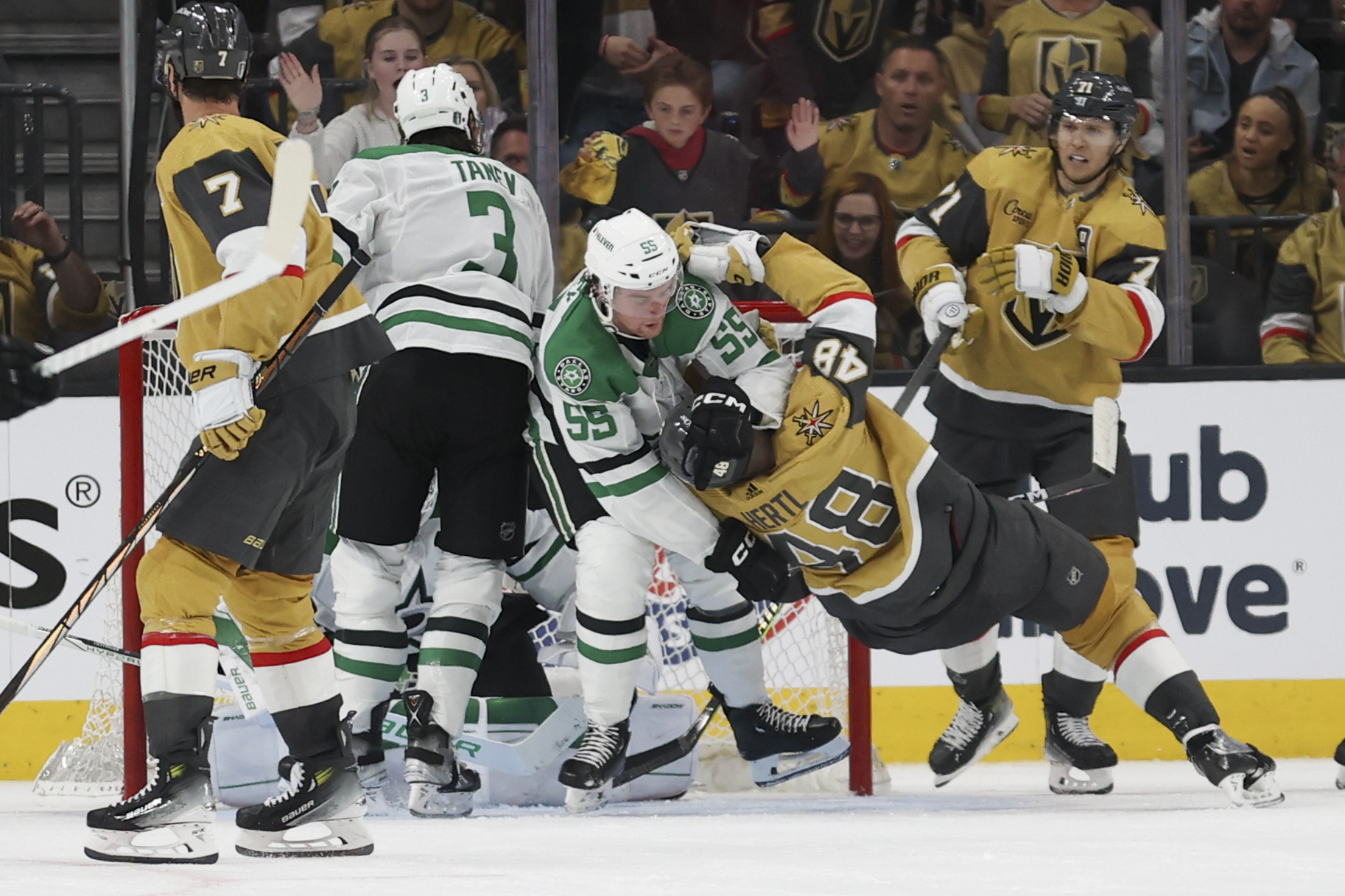 Dallas Stars defenseman Thomas Harley (55) throws Vegas Golden Knights center Tomas Hertl (48) to the ice during the third period in Game 3 of an NHL hockey Stanley Cup first-round playoff series Saturday, April 27, 2024, in Las Vegas.