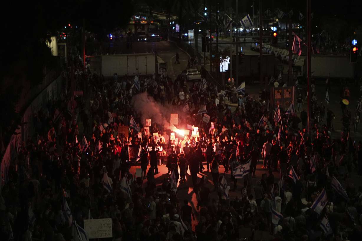 People protest against Israeli Prime Minister Benjamin Netanyahu's government and call for the release of hostages held in the Gaza Strip by the Hamas militant group in Tel Aviv, Israel, Saturday.