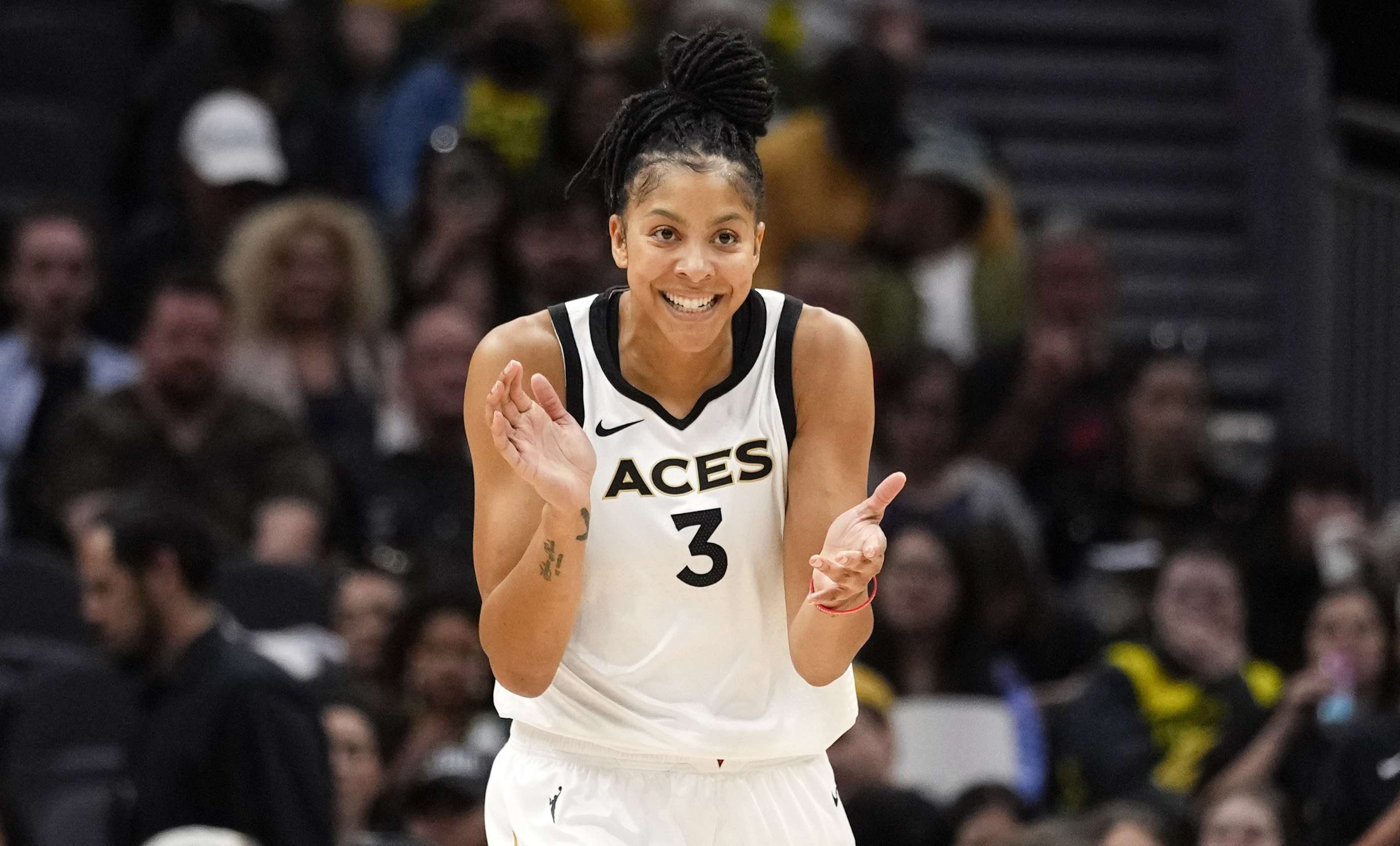 FILE - Las Vegas Aces forward Candace Parker reacts during the first half of a WNBA basketball game against the Seattle Storm, May 20, 2023, in Seattle. The three-time WNBA champion has announced she's retiring. Parker, a two-time league MVP, announced in a social media post on Sunday, April 28, 2024 that she's ending her career after 16 seasons.