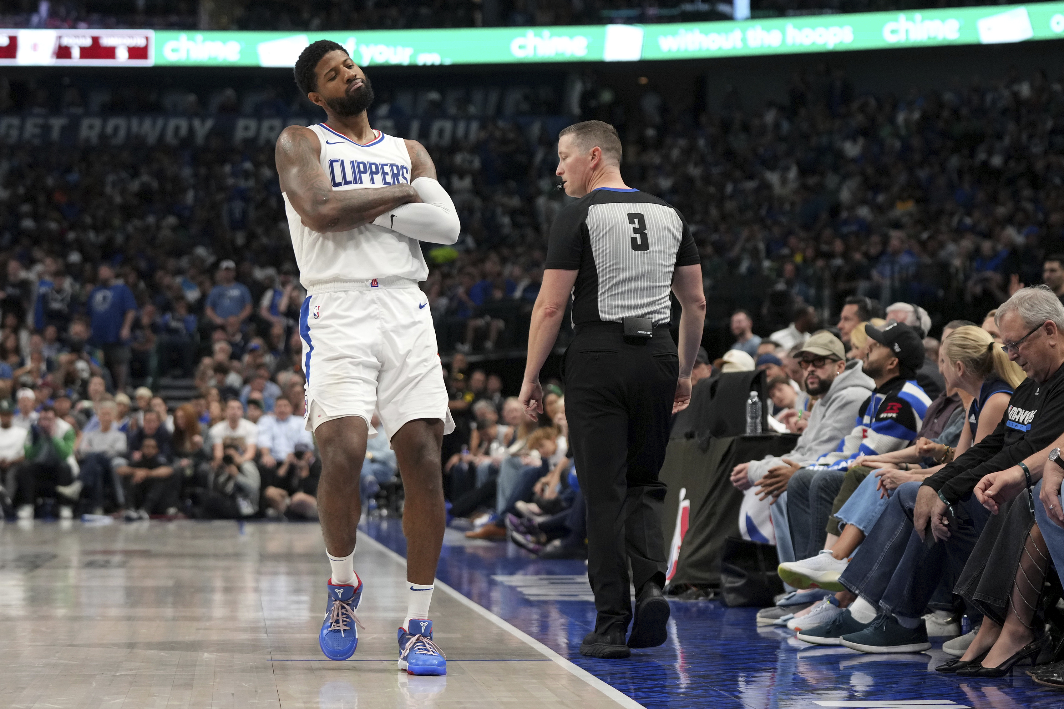 Los Angeles Clippers forward Paul George gestures to the crowd after shooting a 3-point basket during the first half of Game 4 of an NBA basketball first-round playoff series against the Dallas Mavericks, Sunday, April 28, 2024, in Dallas.