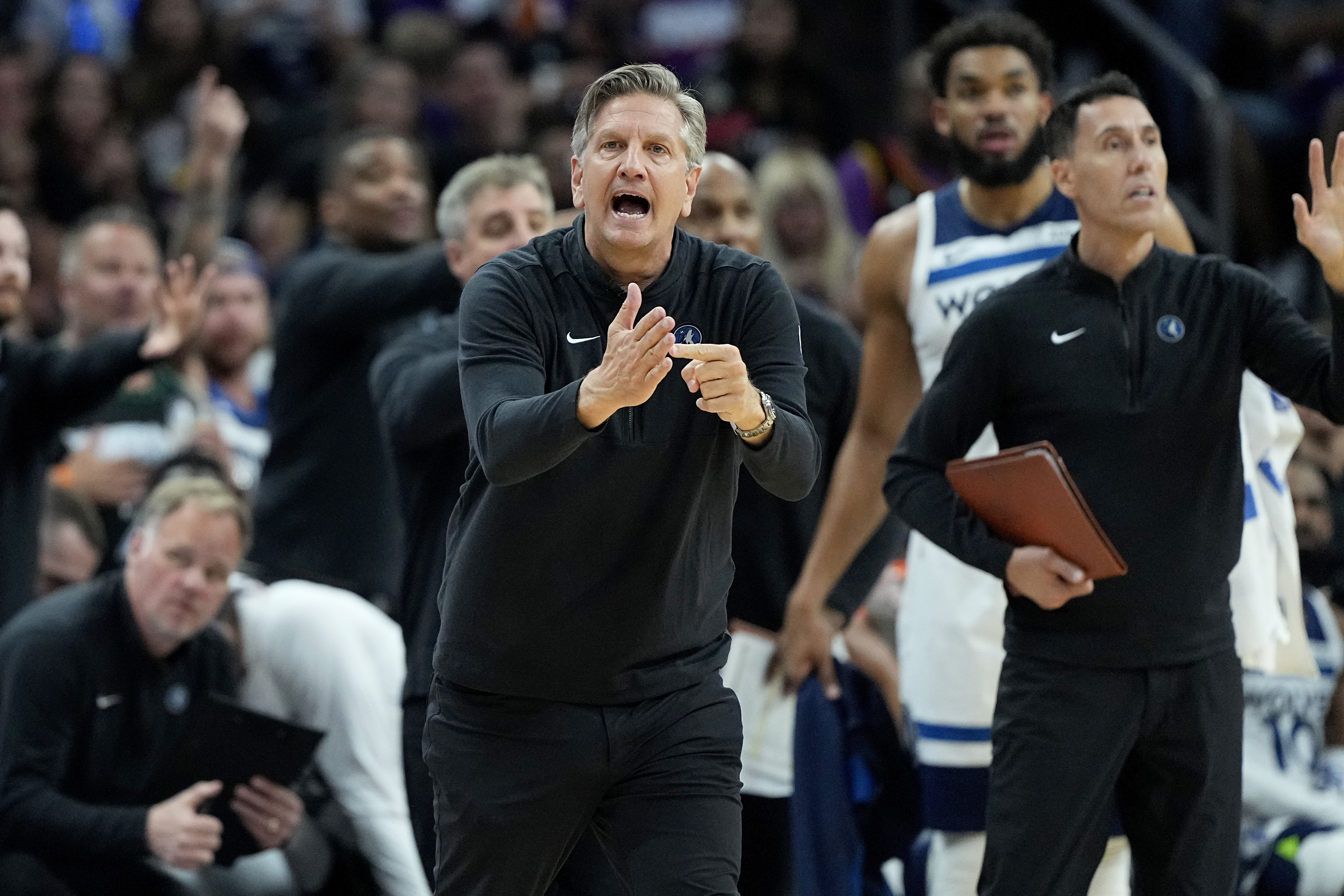 Minnesota Timberwolves head coach hChris Finch calls times out during the second half of Game 3 of an NBA basketball first-round playoff series against the Phoenix Suns, Friday, April 26, 2024, in Phoenix.