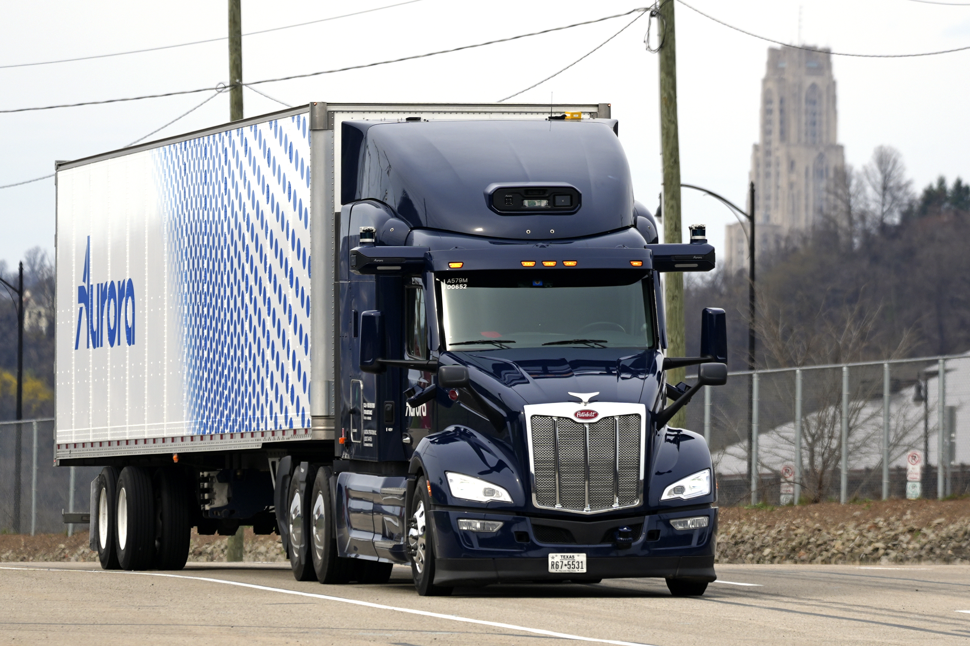 A self-driving tractor trailer maneuvers around a test track in Pittsburgh, March 14. The truck is owned by Pittsburgh-based Aurora Innovation Inc.