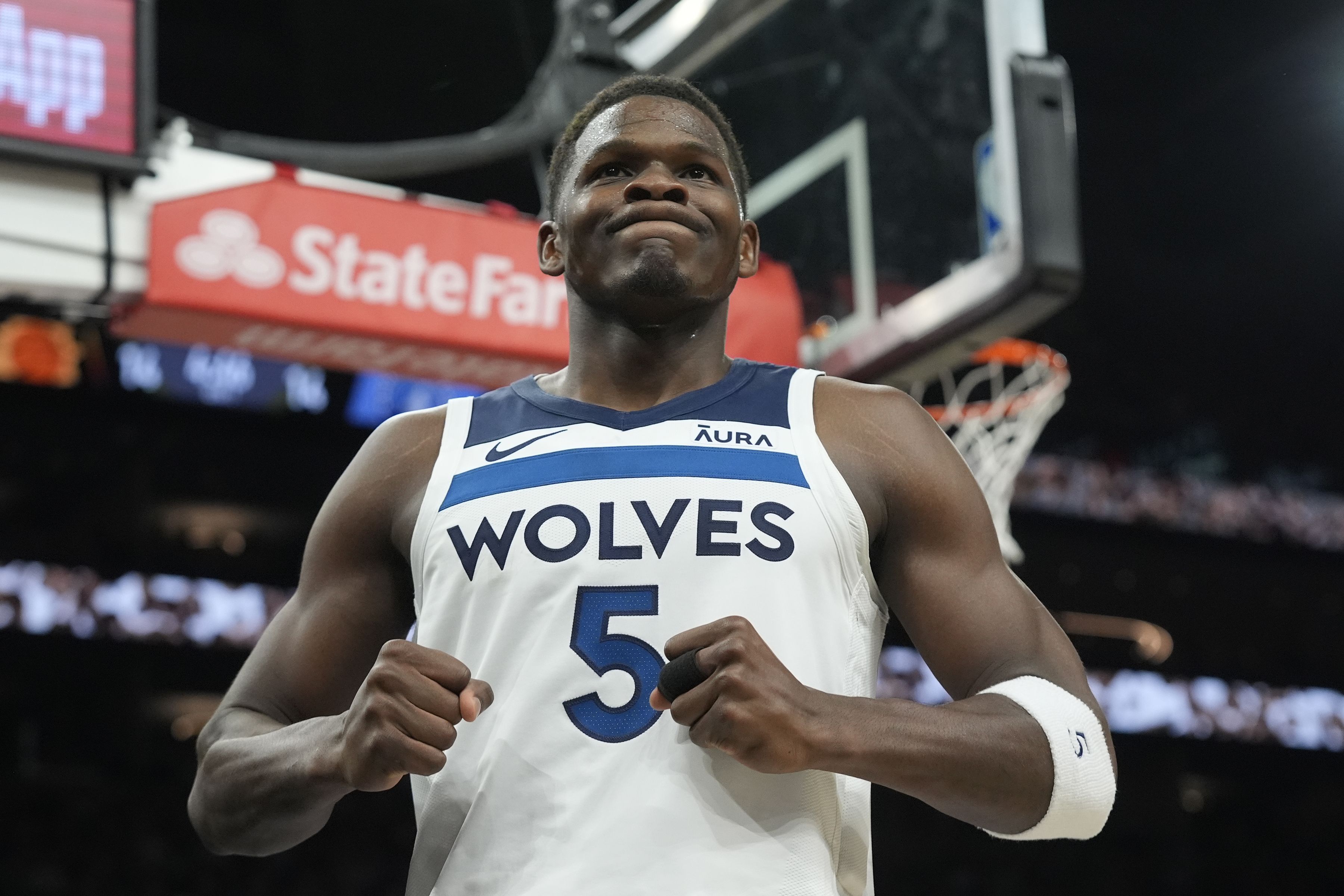 Minnesota Timberwolves guard Anthony Edwards celebrates a foul against the Phoenix Suns during the first half of Game 4 of an NBA basketball first-round playoff series, Sunday, April 28, 2024, in Phoenix. The Timberwolves won 122-116, taking the series 4-0.