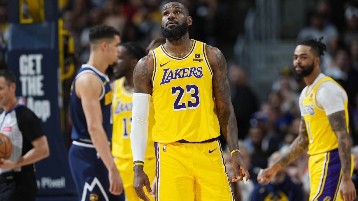 Los Angeles Lakers forward LeBron James (23) checks the scoreboard in the first half of Game 5 of an NBA basketball first-round playoff series against the Denver Nuggets, Monday, April 29, 2024, in Denver.