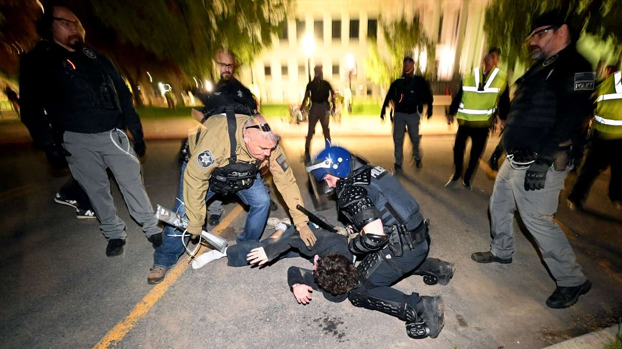 Police move in and make arrests on demonstrators gathered to show support for Palestine at the University of Utah in Salt Lake City on Monday.