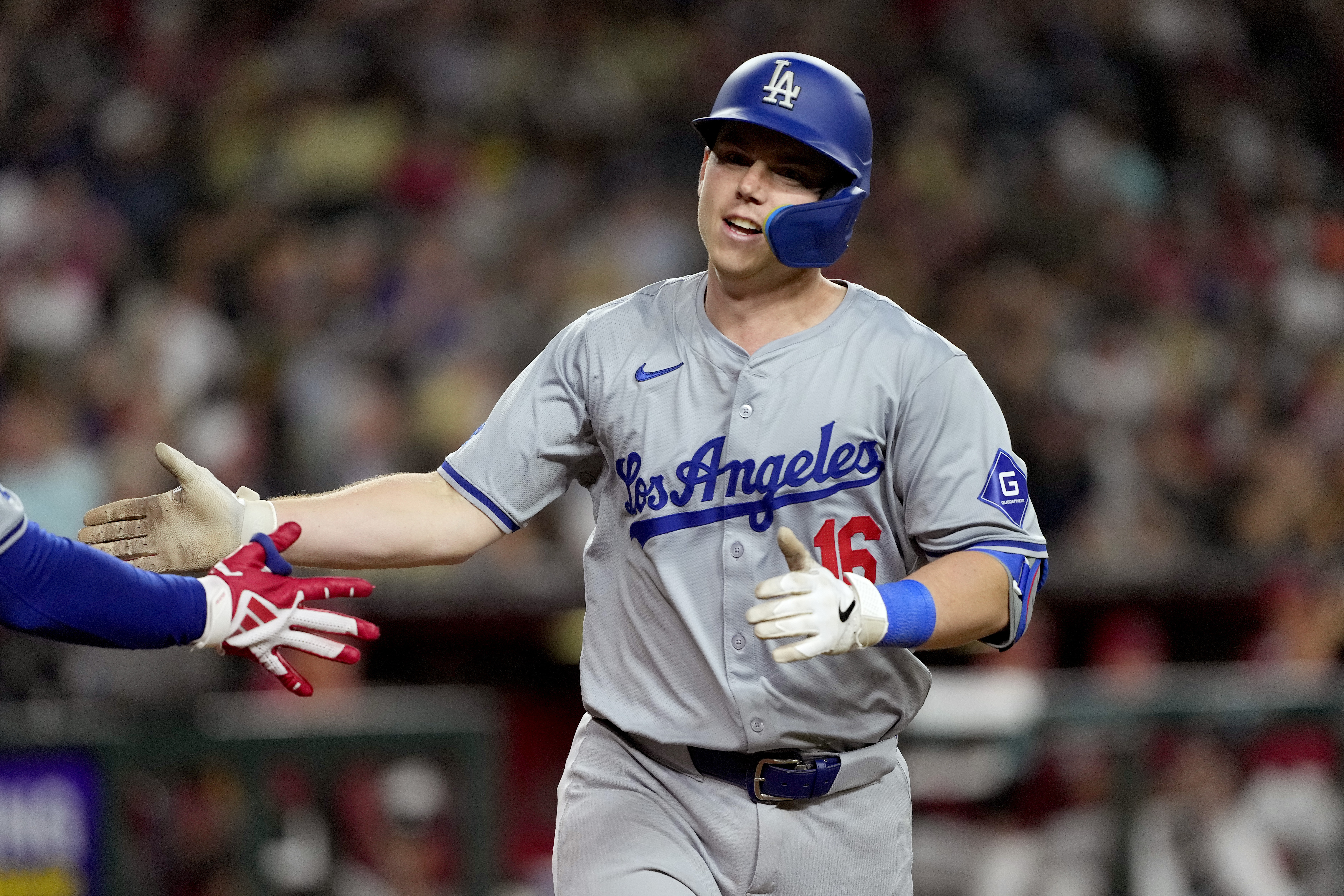 Los Angeles Dodgers' Will Smith crosses the plate after hitting a solo home run during the sixth inning of a baseball game against the Arizona Diamondbacks, Monday, April 29, 2024, in Phoenix.