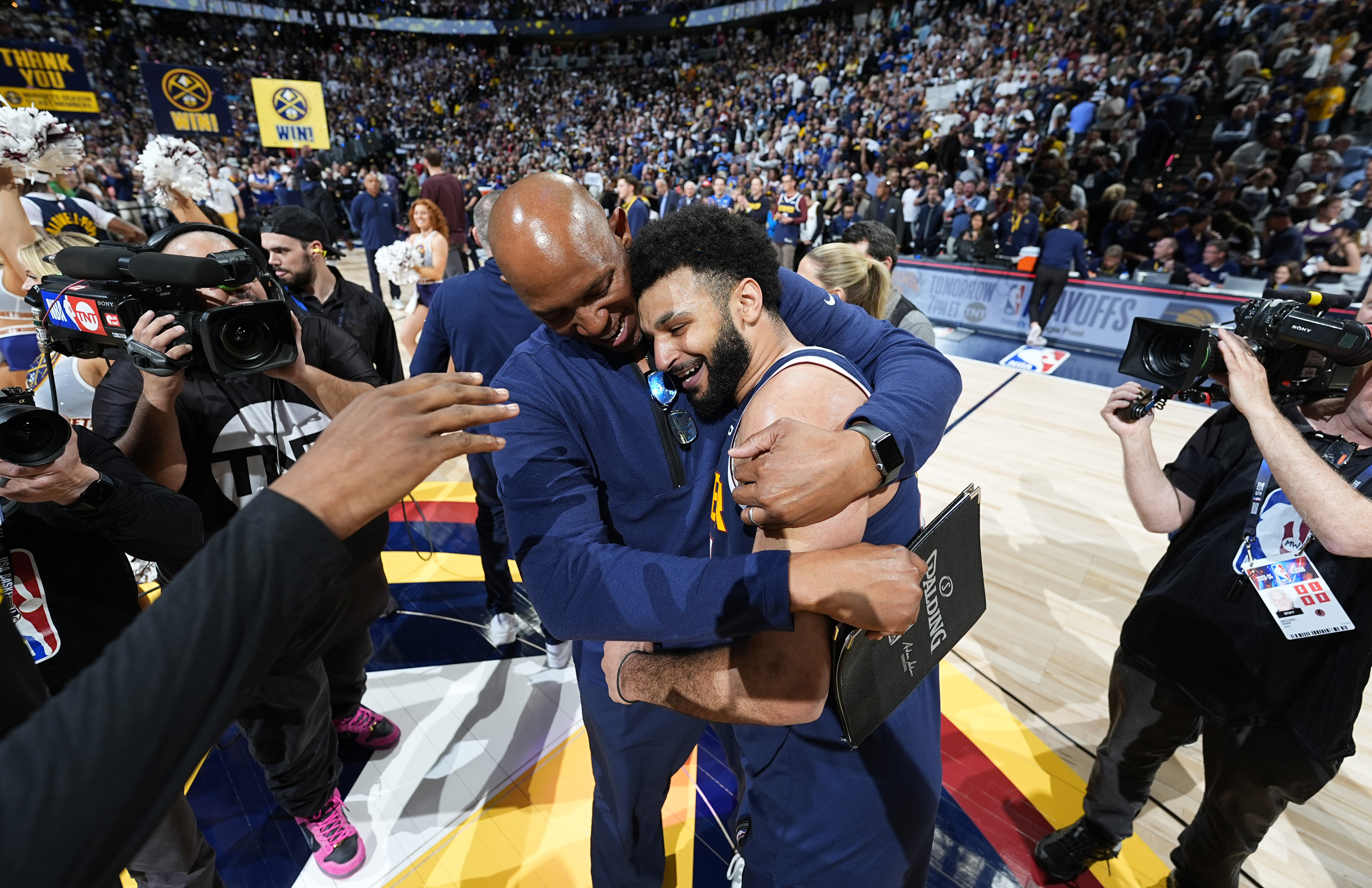 Denver Nuggets assistant coach Popeye Jones, left, hugs guard Jamal Murray after Game 5 of an NBA basketball first-round playoff series against the Los Angeles Lakers Monday, April 29, 2024, in Denver. Murray scored 32 points despite a strained calf and sank the game-winner with 3.6 seconds left to win over the Lakers.