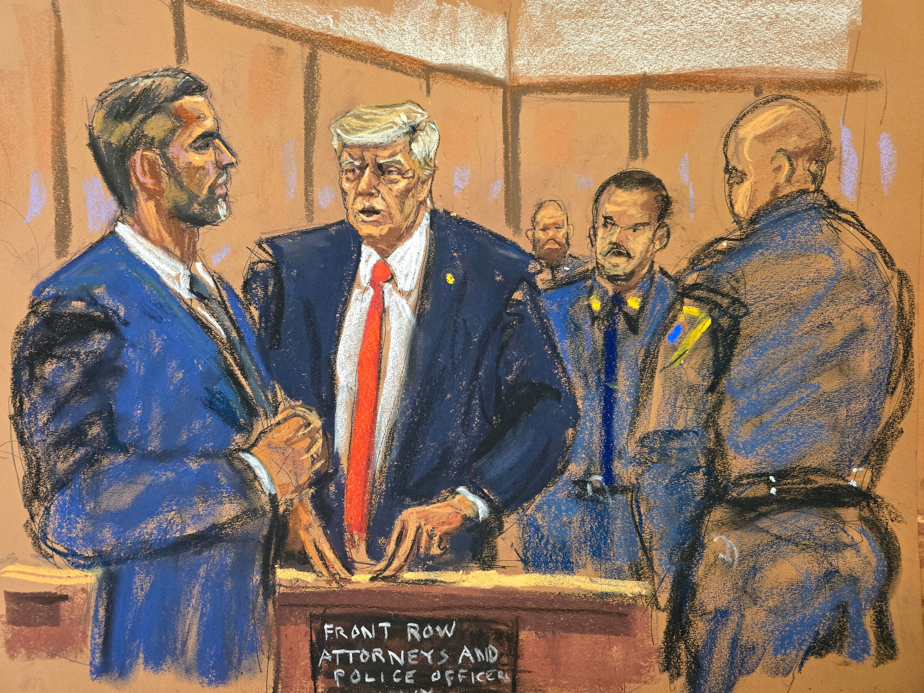 Former president Donald Trump chats with his son Eric Trump during his criminal trial on charges that he falsified business records, in state court in New York City, Tuesday, in this courtroom sketch.