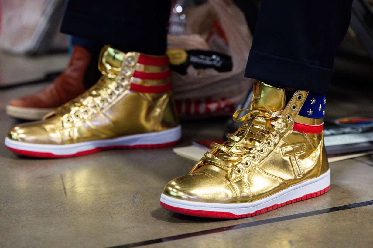 Former President Donald Trump’s official sneakers are pictured on an attendee at the Utah Republican Party state nominating convention at the Salt Palace Convention Center in Salt Lake City on Saturday.