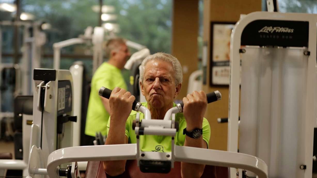 Jeff Rudes, 74, works out at Life Time Athletic gym on March 10, 2020, in Boca Raton, Fla. Research suggests that being physically active in midlife is a factor that can contribute to becoming one.