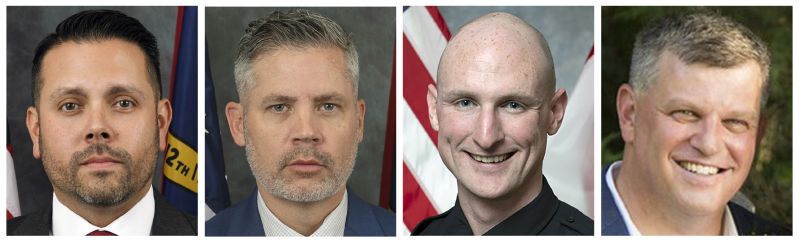 This image shows from left, Sam Poloche and William Elliott of the North Carolina Department of Adult Corrections; Charlotte-Mecklenburg Officer Joshua Eyer; and Deputy U.S. Marshal Thomas Weeks. The four officers were killed and four others were wounded, Monday in suburban Charlotte, N.C.