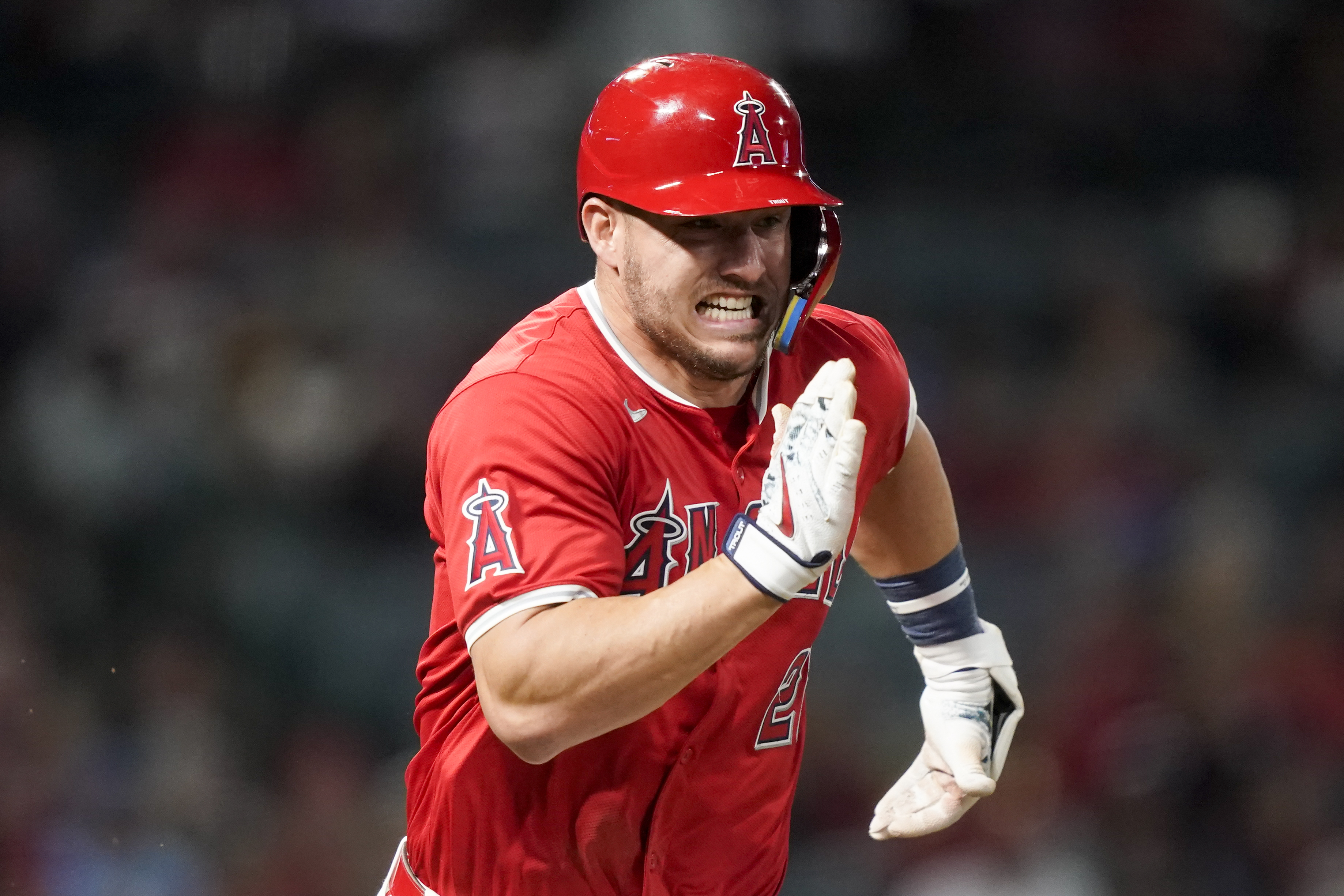 Los Angeles Angels' Mike Trout runs after a single during the seventh inning of a baseball game against the Philadelphia Phillies, Monday, April 29, 2024, in Anaheim, Calif.