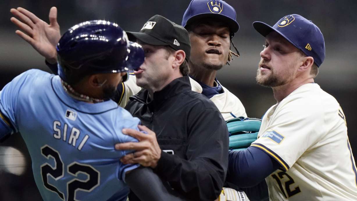 Tampa Bay Rays' Jose Siri (22) fights with Milwaukee Brewers' Abner Uribe, middle, during the eighth inning of a baseball game Tuesday, April 30, 2024, in Milwaukee.