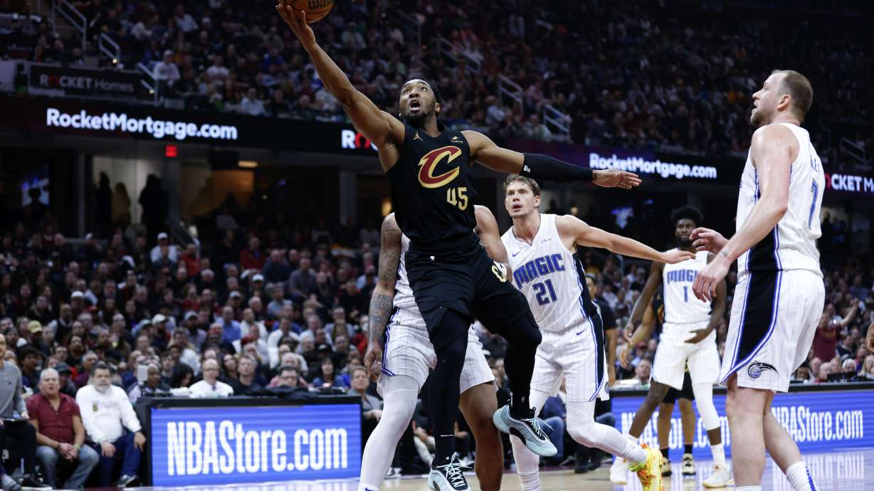 Cleveland Cavaliers guard Donovan Mitchell (45) shoots against the Orlando Magic during the first half of Game 5 of an NBA basketball first-round playoff series, Tuesday, April 30, 2024, in Cleveland.