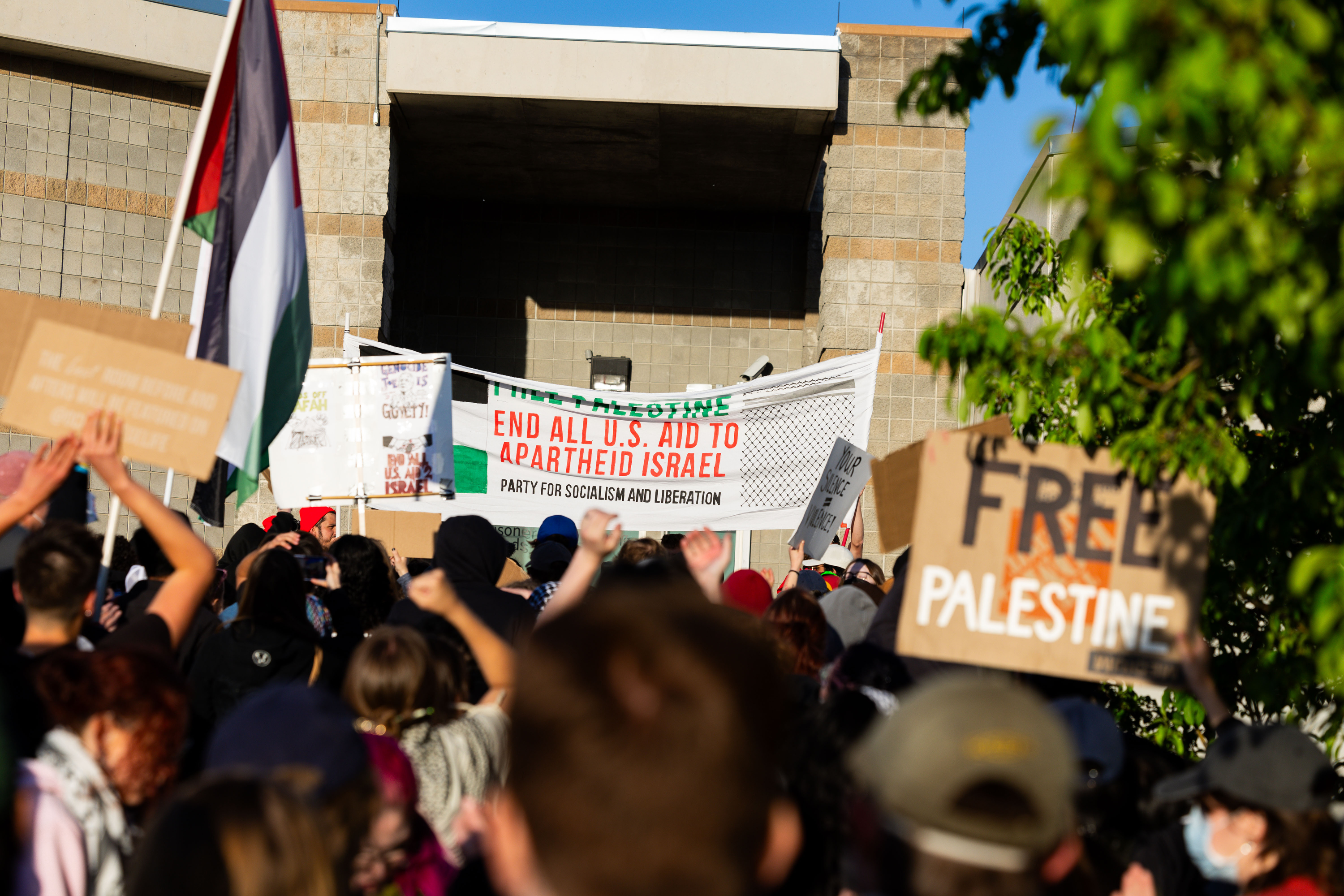 Demonstrators walk up the steps as they gather in support of Palestine and to defend the right for students to assemble and protest at Salt Lake County Metro Jail in South Salt Lake on Tuesday. An alleged organizer of the protest was arrested and released.