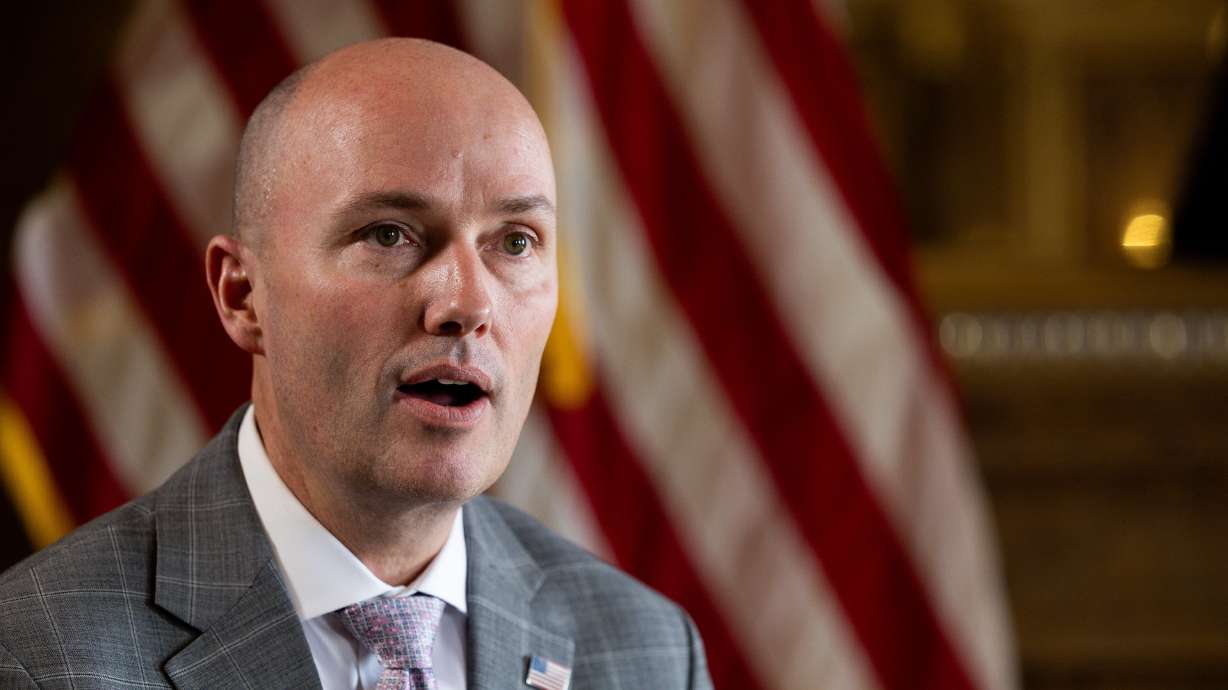 Utah Gov. Spencer Cox speaks at the state Capitol on March 1. Cox on Tuesday announced a state plan to assist the Trump administration in deporting undocumented immigrants who have committed crimes and "demonstrate a threat to public safety."
