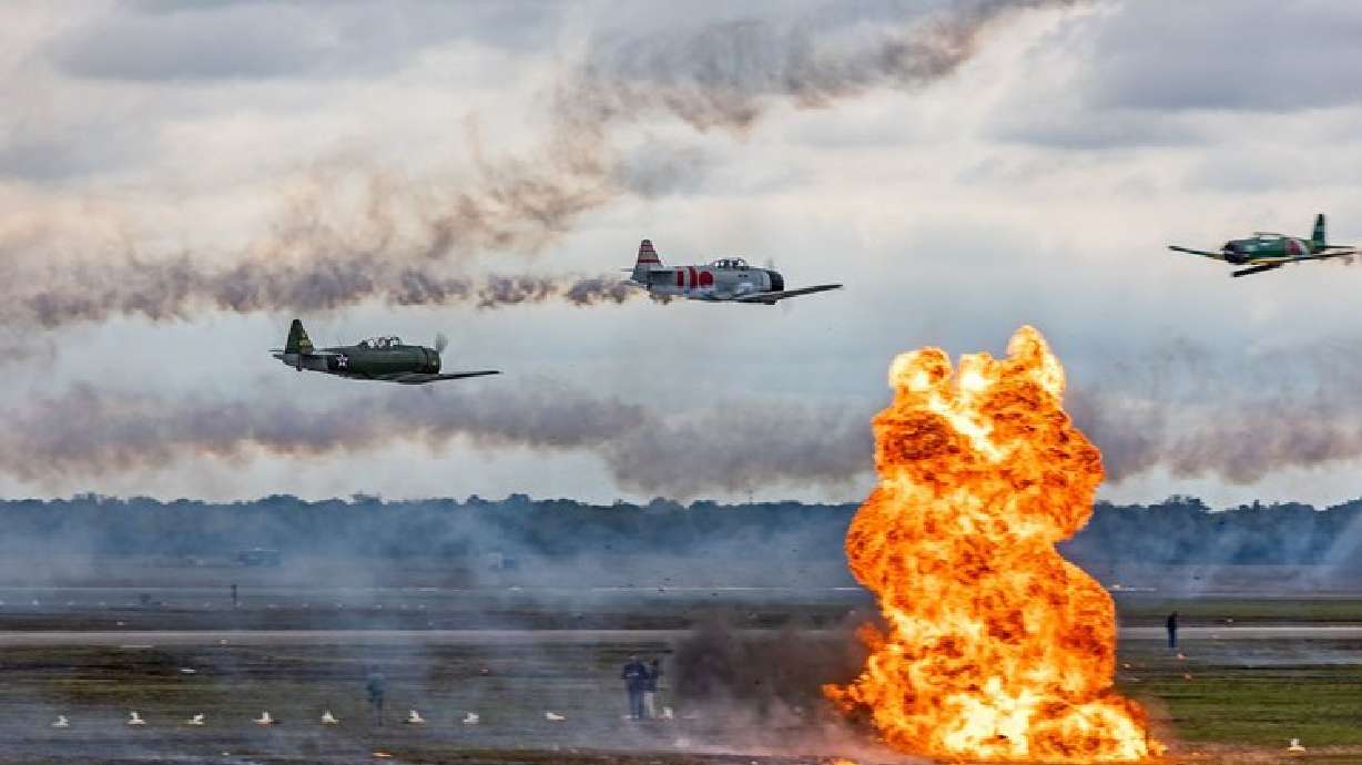 Pilots from the Tora Tora Tora airshow team use pyrotechnics to reenact the Japanese attack on Pearl Harbor.
