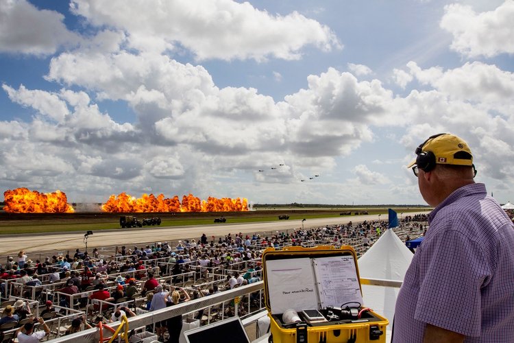 A controller watches the pyrotechnic display of Tora Tora Tora, an airshow team that reenacts the Japanese attack on Pearl Harbor on December 7, 1941.