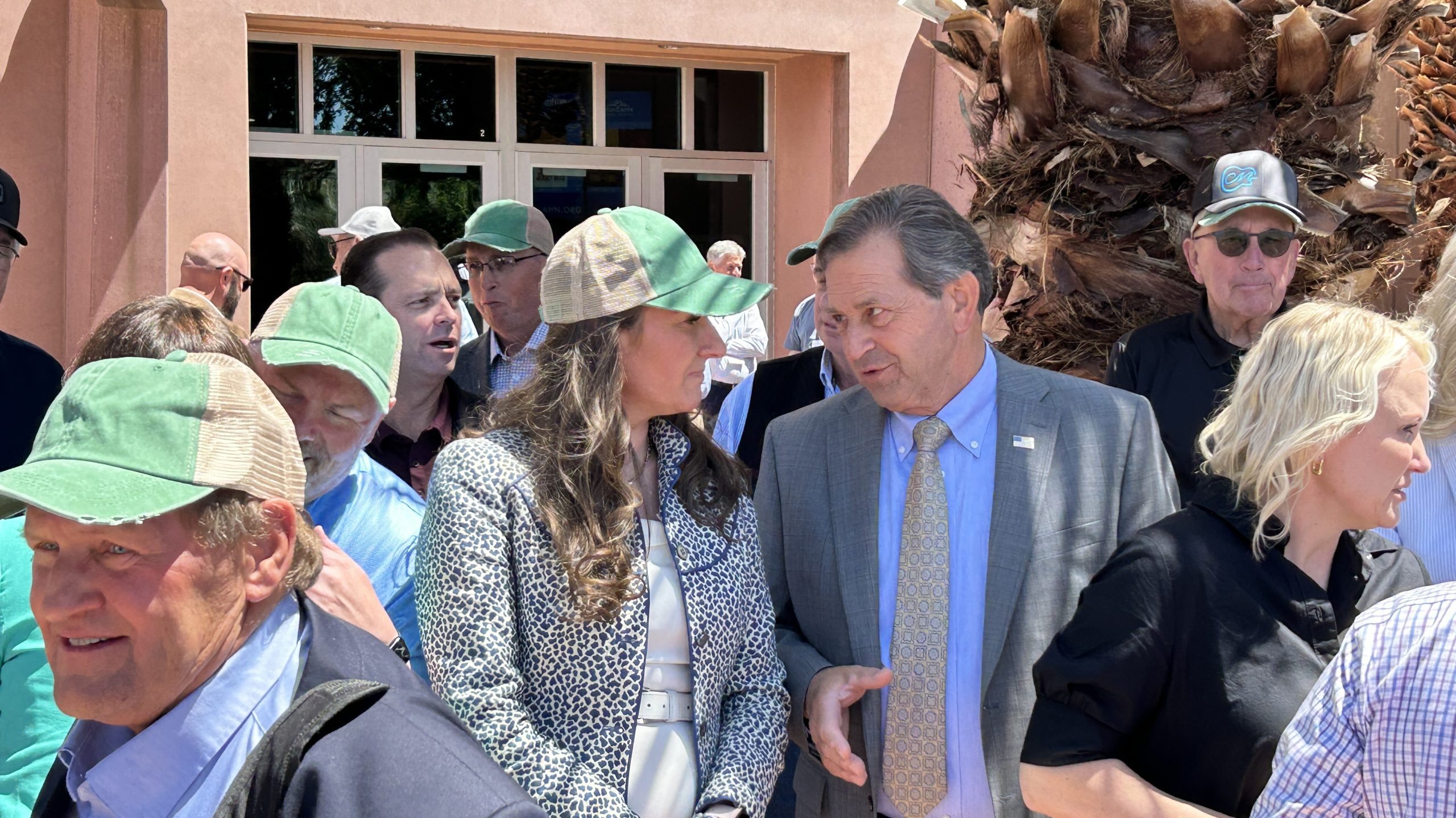 From left, Utah County Commissioner Amelia Powers Gardner and Washington County Commissioner Gil Almquist share a conversation in front of the Dixie Center St. George for an appearance with Utah Gov. Spencer Cox, St. George.