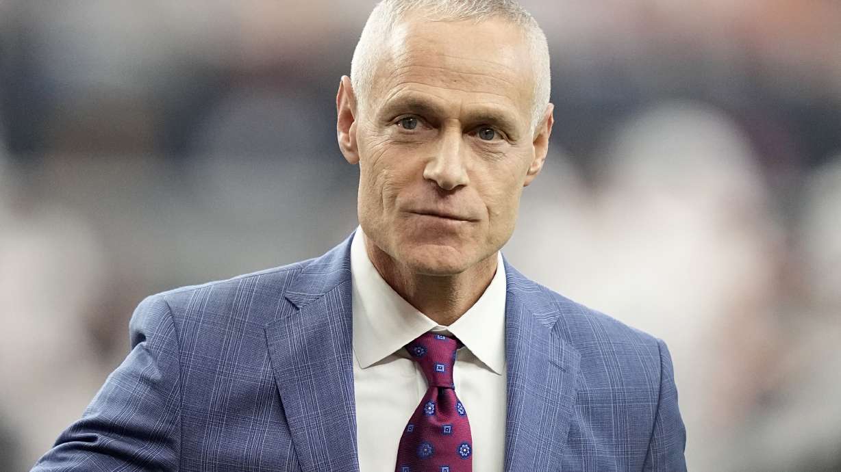 FILE - Big 12 Commissioner Brett Yormark participates in announcement on the field during the first half of the Big 12 Conference championship NCAA college football game between Oklahoma State and Texas in Arlington, Texas, Dec. 2, 2023. Before the new Big 12 — sans Oklahoma and Texas — even kicks off, the expanded College Football Playoff's new revenue structure has created a perception that the conference is not quite the equal of the Big Ten and Southeastern Conference.