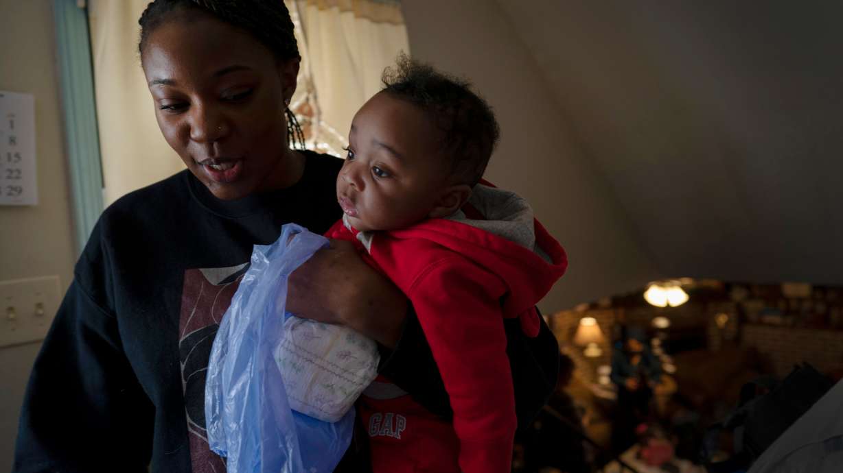 Ansonia Lyons carries her son, Adrien Lyons, in Birmingham, Ala., on Feb. 5, 2022. The number of maternal deaths in the U.S. declined in 2022 after several years of increases, according to new data.