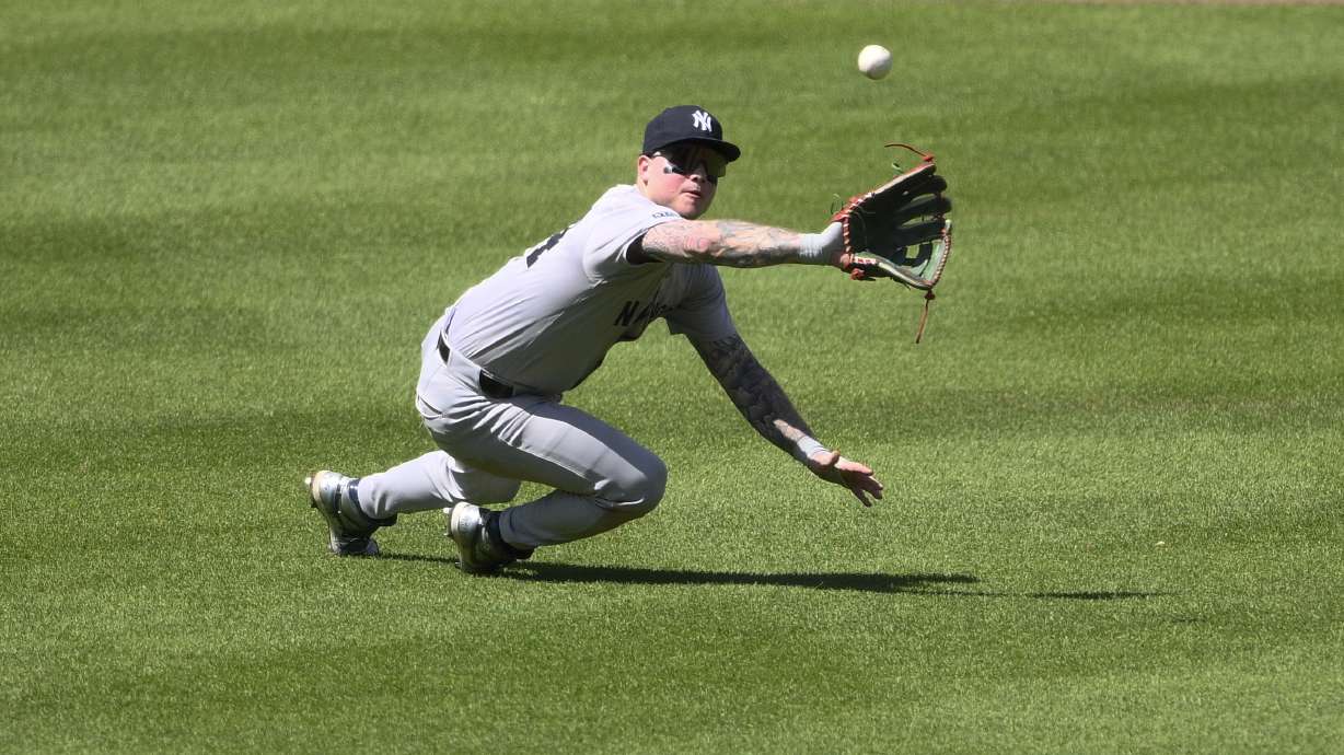 New York Yankees left fielder Alex Verdugo prepares to make a catch on a sacrifice fly by Baltimore Orioles' Jorge Mateo during the fifth inning of a baseball game, Thursday, May 2, 2024, in Baltimore.