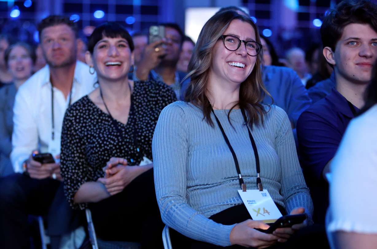 Audience members laugh during the Qualtrics X4 Tech Summit at the Salt Palace Convention Center in Salt Lake City on Thursday.