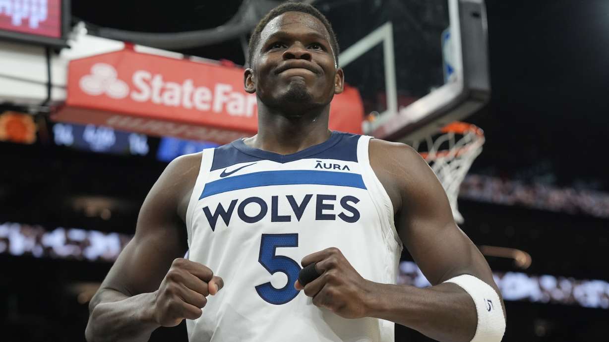 Minnesota Timberwolves guard Anthony Edwards celebrates a foul against the Phoenix Suns during the first half of Game 4 of an NBA basketball first-round playoff series, Sunday, April 28, 2024, in Phoenix. The Timberwolves won 122-116, taking the series 4-0.