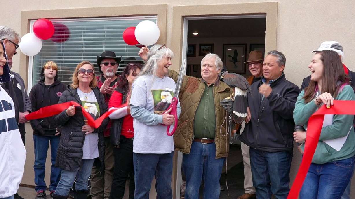 Staff and patrons of the Enoch Wildlife Rescue Center celebrate the center's grand opening in Enoch, April 27.