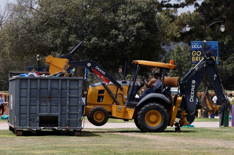 A person operating a bulldozer removes the remnants of a protest encampment in support of Palestinians, that was broken down by police the previous night on the campus of University of California Los Angeles in L.A., Thursday.