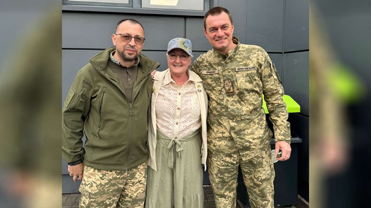 Terri Hepworth, center, traveled to Ukraine after she met some soldiers in this undated photo.