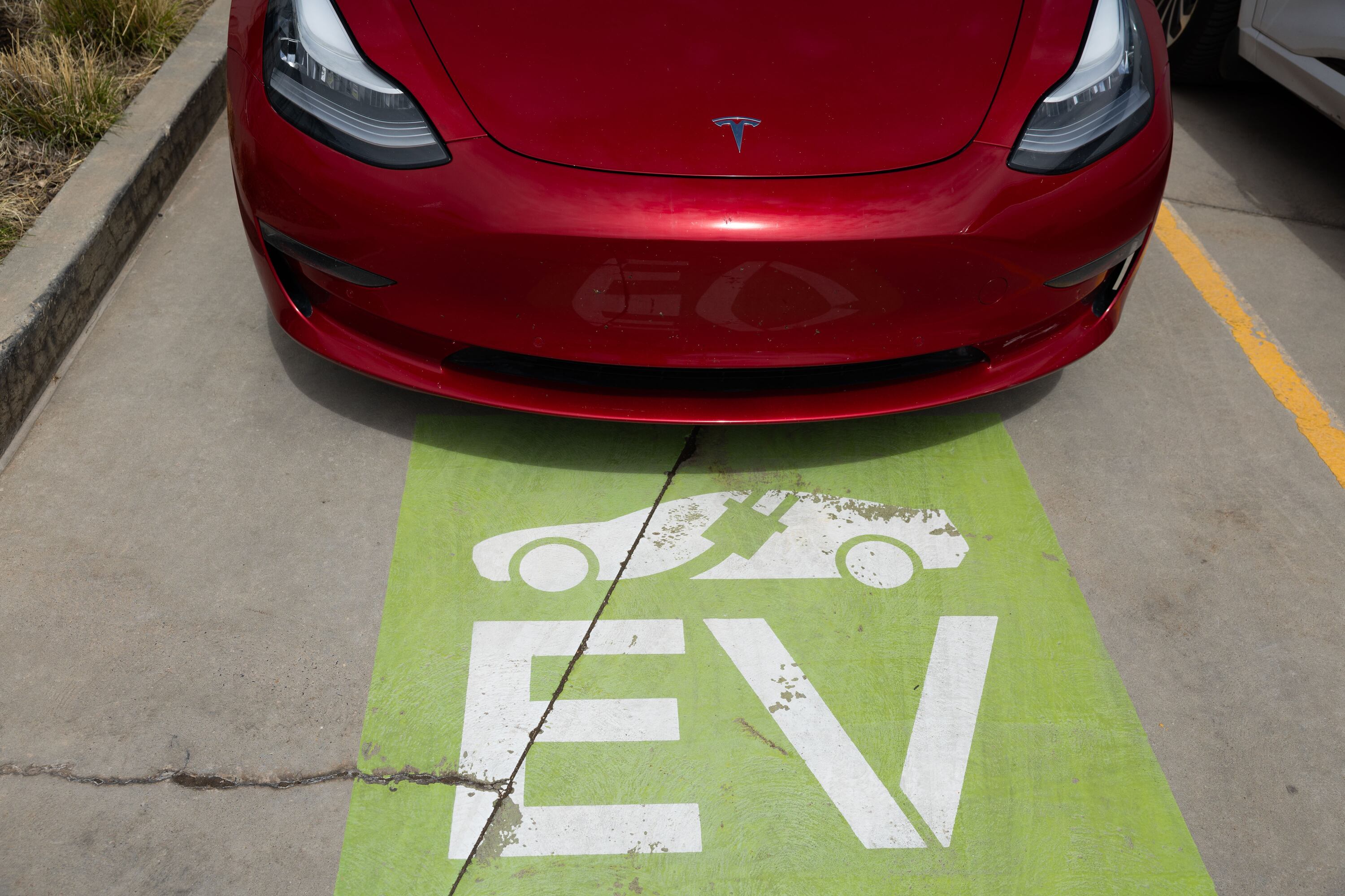 A Tesla is parked at an electric charging station outside of the state Capitol in Salt Lake City on Thursday. Sen. Mitt Romney, R-Utah, joined a bipartisan and bicameral group of colleagues to block President Joe Biden’s electric vehicle mandates.