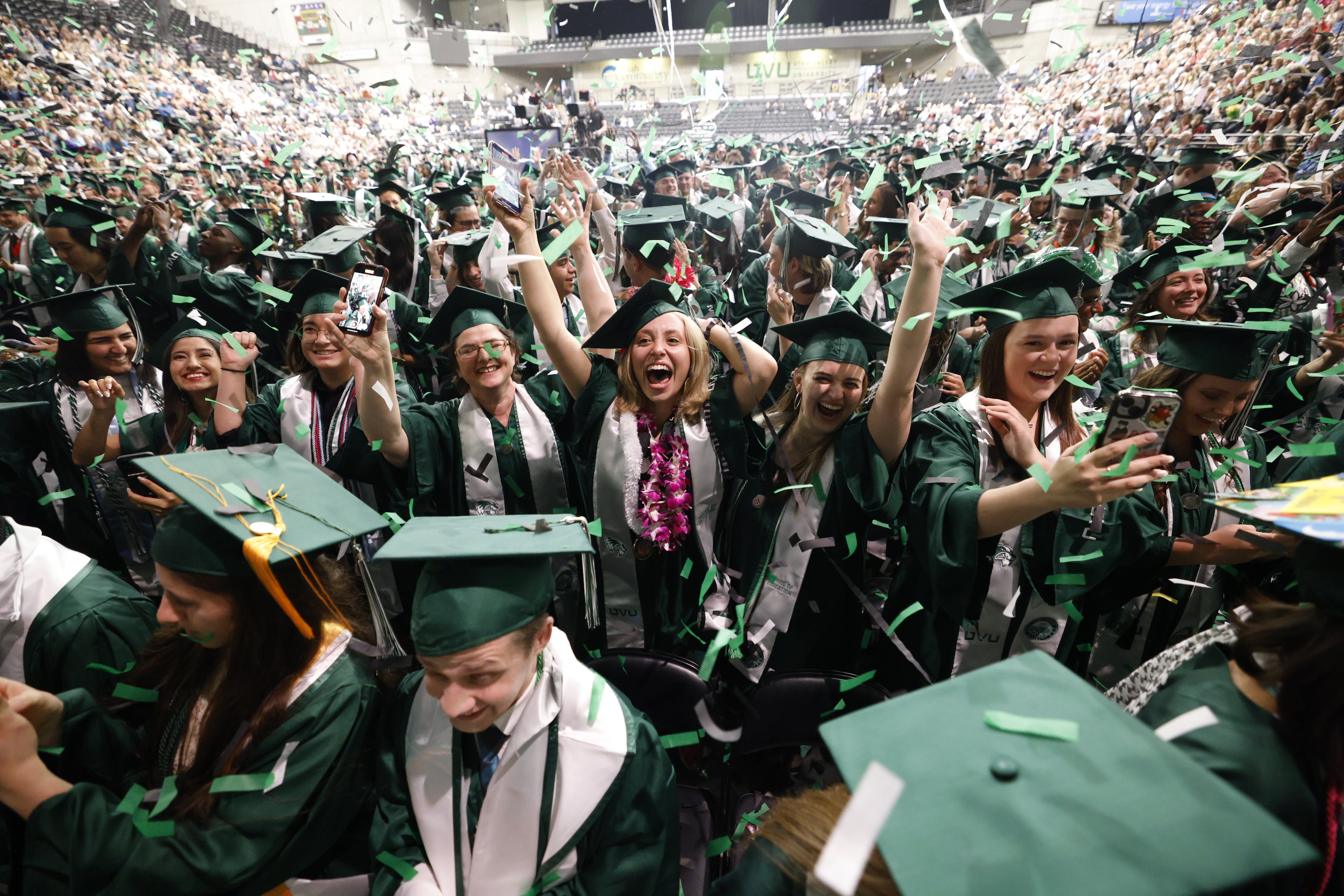 Utah Valley University students celebrate graduation on Thursday in Orem.