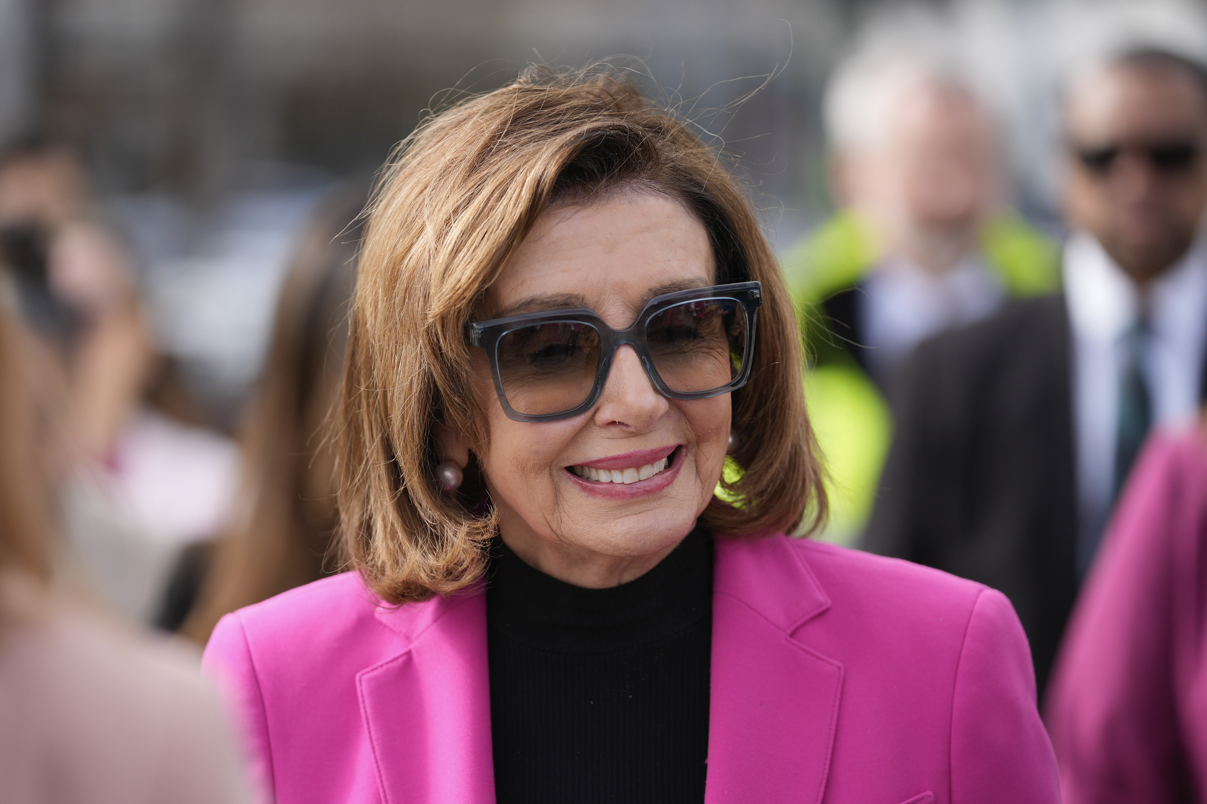 Speaker Emerita Nancy Pelosi walks to a news conference to address sea level rise along the city's waterfront in San Francisco, Jan. 26. She is one of 19 people receiving the Presidential Medal of Freedom on Friday.