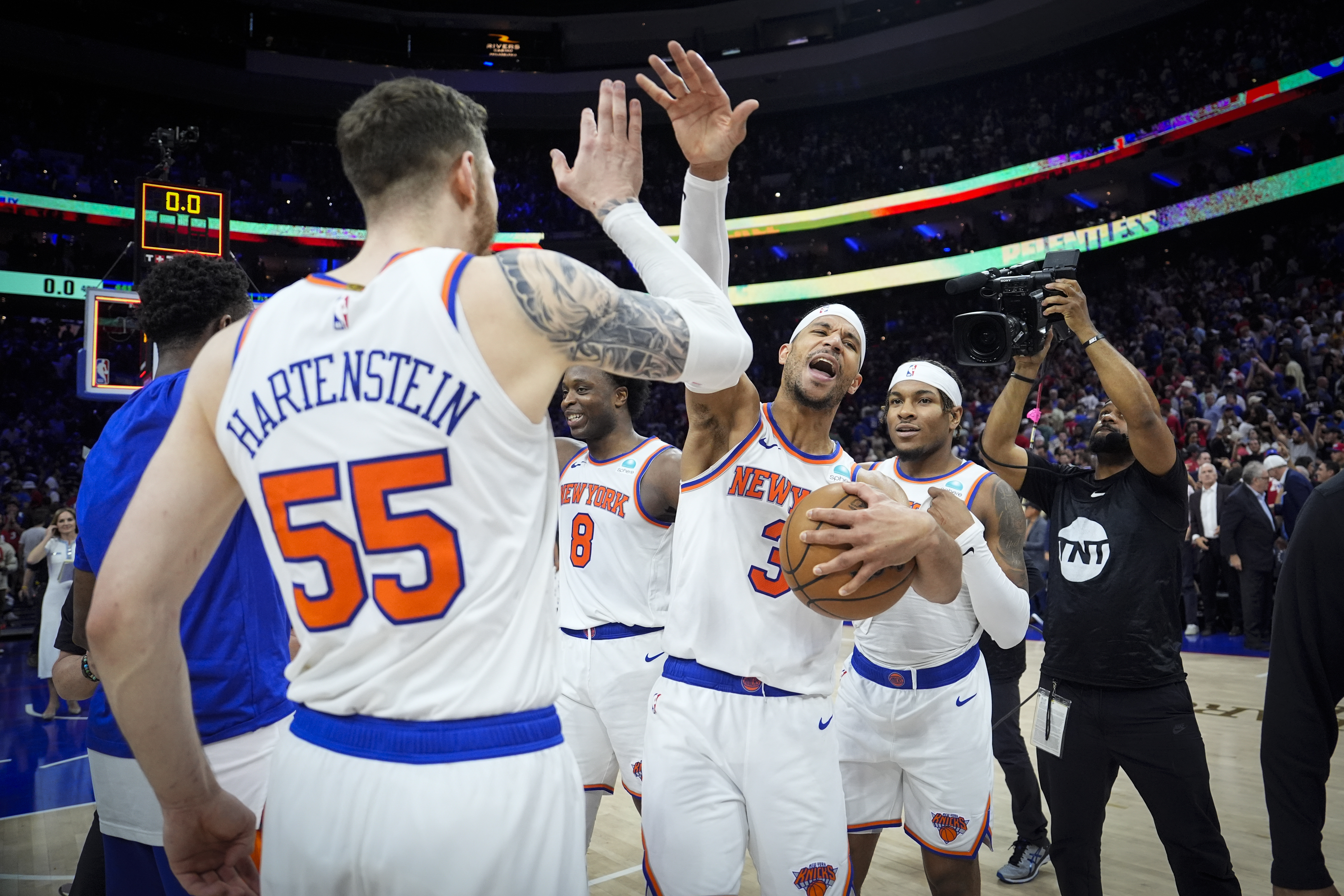 New York Knicks' Josh Hart (3) and teammate Isaiah Hartenstein (55) celebrate after winning Game 6 in an NBA basketball first-round playoff series against the Philadelphia 76ers, Thursday, May 2, 2024, in Philadelphia.