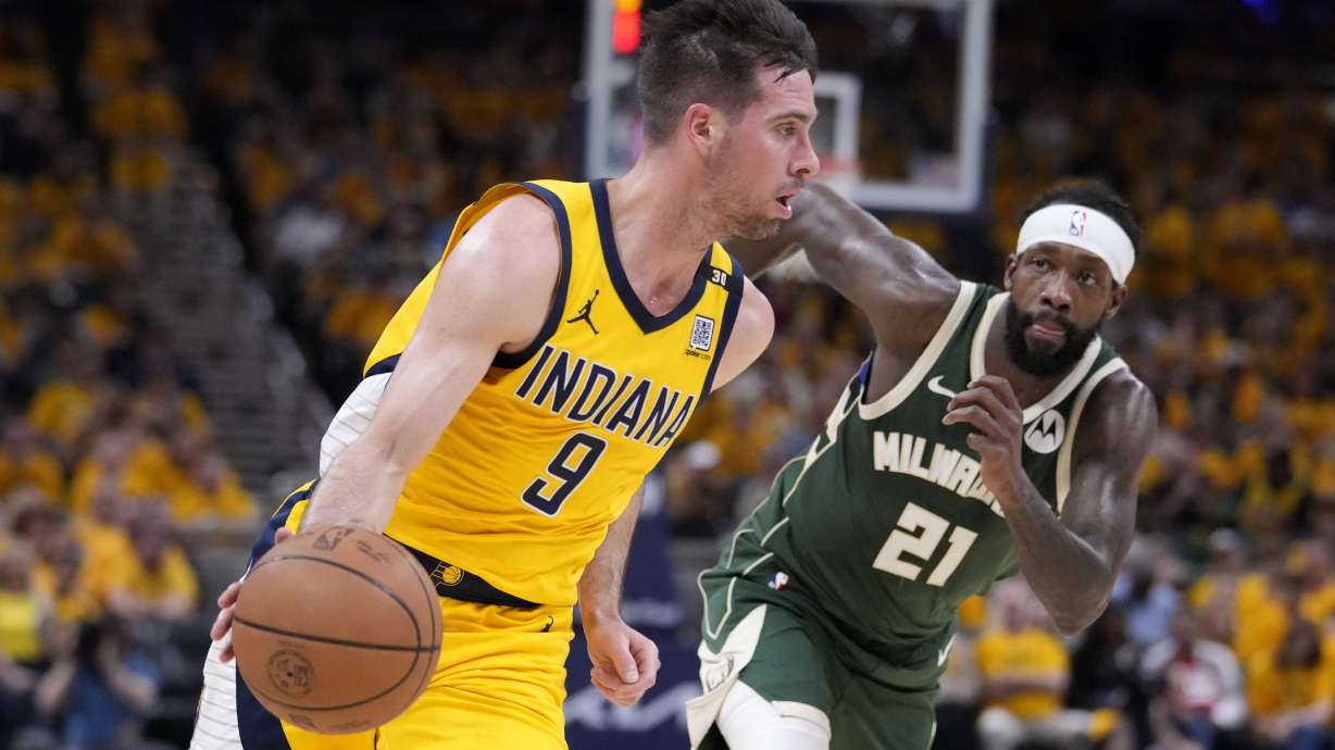 Indiana Pacers guard T.J. McConnell (9) drives past Milwaukee Bucks guard Patrick Beverley (21) during the first half in Game 6 in an NBA basketball first-round playoff series, Thursday, May 2, 2024, in Indianapolis.