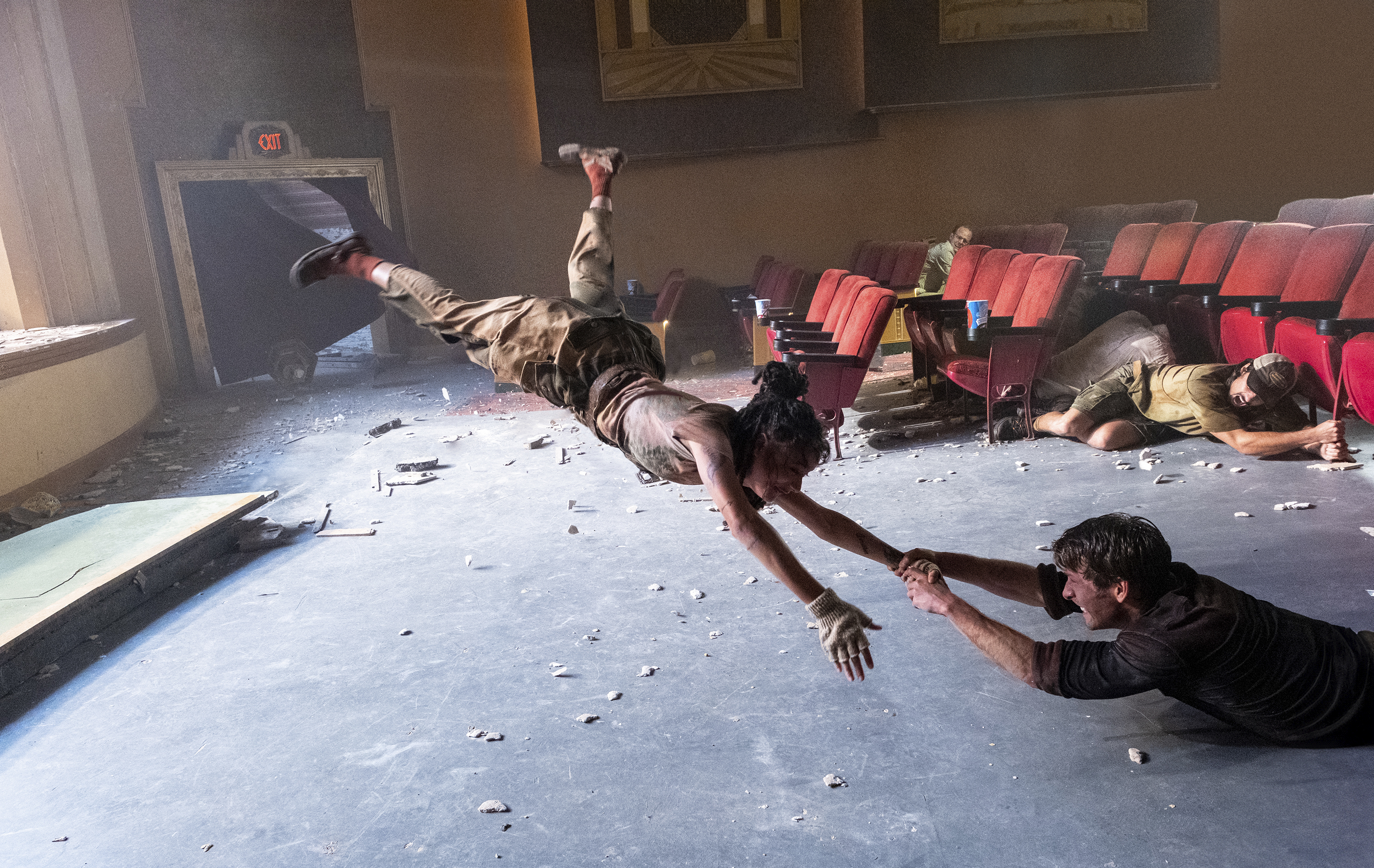 This image released by Universal Pictures shows Sasha Lane, left, and Glen Powell in a scene from "Twisters."