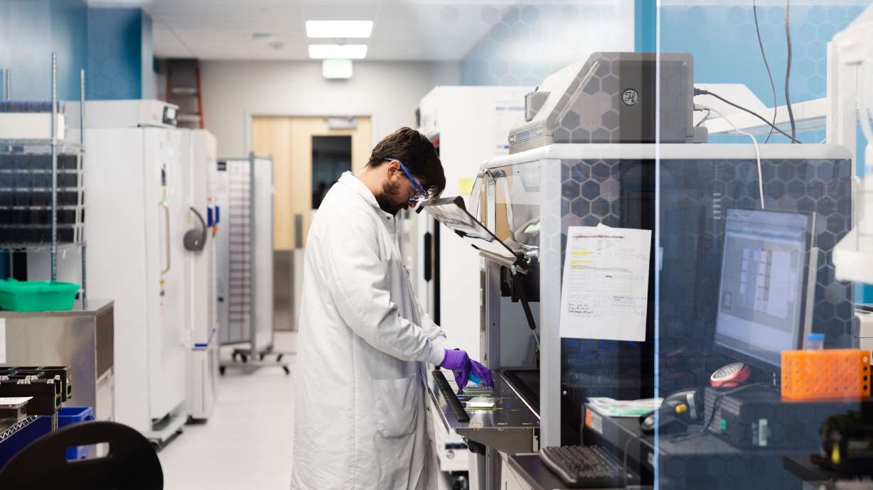 A researcher works in a lab at the Recursion offices in Salt Lake City on June 20, 2023. Around 50 high school student on Friday spent the day getting an inside look at potential future STEM careers as part of the annual Human Innovation Day.