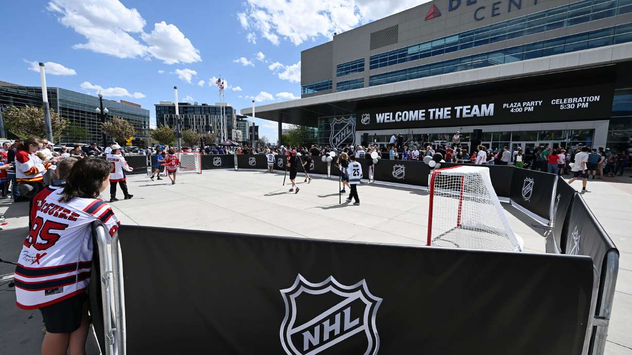 Kids play street hockey ahead of the doors opening as thousands attend the NHL event at the Delta Center in Salt Lake City on April 24. KSL obtained the document Smith Entertainment Group filed to Salt Lake City for a proposed revitalization district, which outlines its intent to remain at the arena and focus on improvements around it.