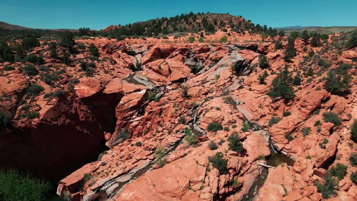Water flows down the red rocks at Gunlock State Park in Gunlock, April 10. Southern Utahns chasing waterfalls this spring are in luck as the park's “unpredictable” falls are flowing.