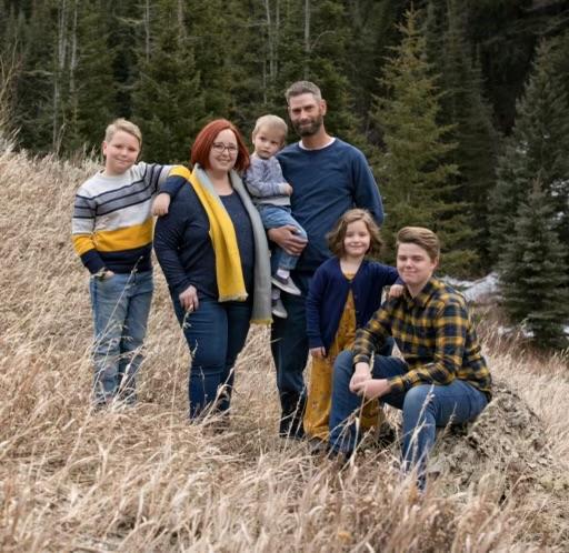 Sarah and Reino Kerttula are with four of their five children. After the children lost their father when he tried to save them following a crash, the community came together to give the family an SUV.