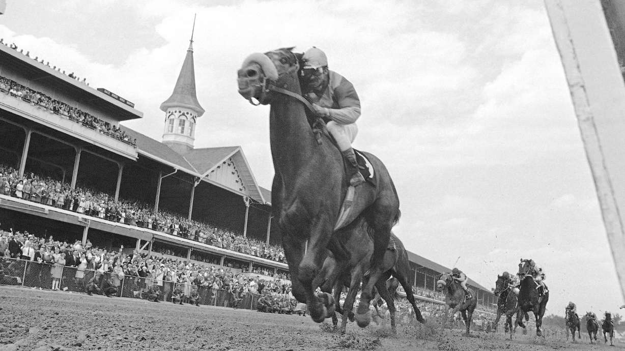 FILE - In this May 4, 1968, file photo, Dancer's Image, jockey Bob Ussery up, crosses the finish line to win the 94th running of the Kentucky Derby at Churchill Downs in Louisville, Ky. America’s longest continuously held sporting event turns 150 years old Saturday. The Kentucky Derby has survived two world wars, the Depression and pandemics, including COVID-19 in 2020, when it ran in virtual silence without the usual crowd of 150,000.