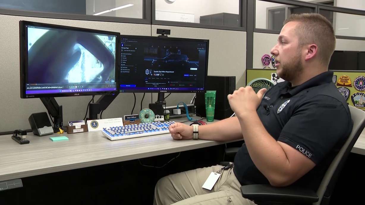 Tooele City Police Cpl. Colbey Bentley watching footage from the struggle.