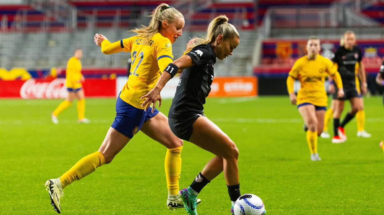 From left, Utah Royals’ Dana Foederer chases after Angel City’s Sarah Gorden who has possession of the ball during a game at America First Field in Sandy on Friday, May 3, 2024.