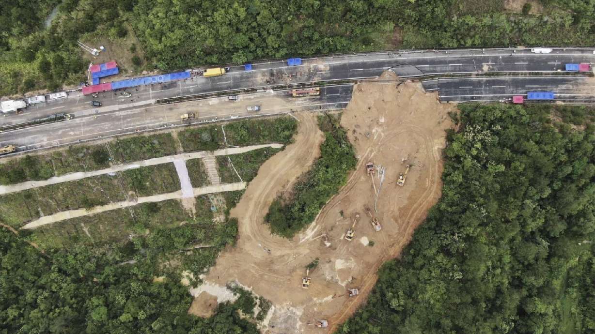 In this aerial photo released by Xinhua News Agency, rescue workers at the site of a collapsed section of a highway on the Meizhou-Dabu Expressway in Meizhou, southern China’s Guangdong Province on Thursday.