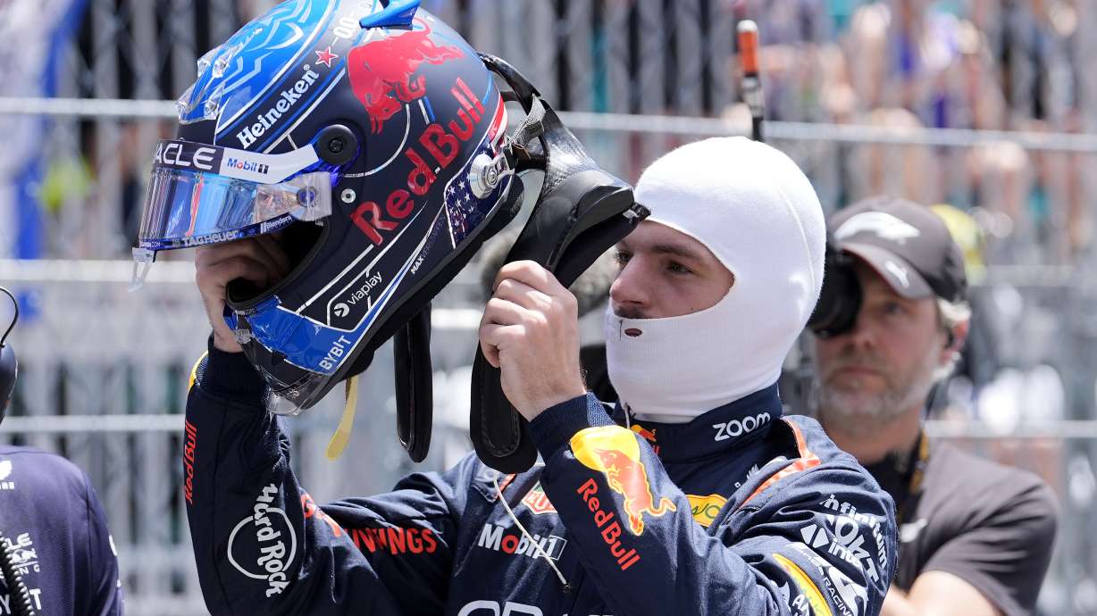 Red Bull driver Max Verstappen, of the Netherlands, puts on his helmet before the Sprint race at the Miami Formula One Grand Prix, Saturday, May 4, 2024, in Miami Gardens, Fla.