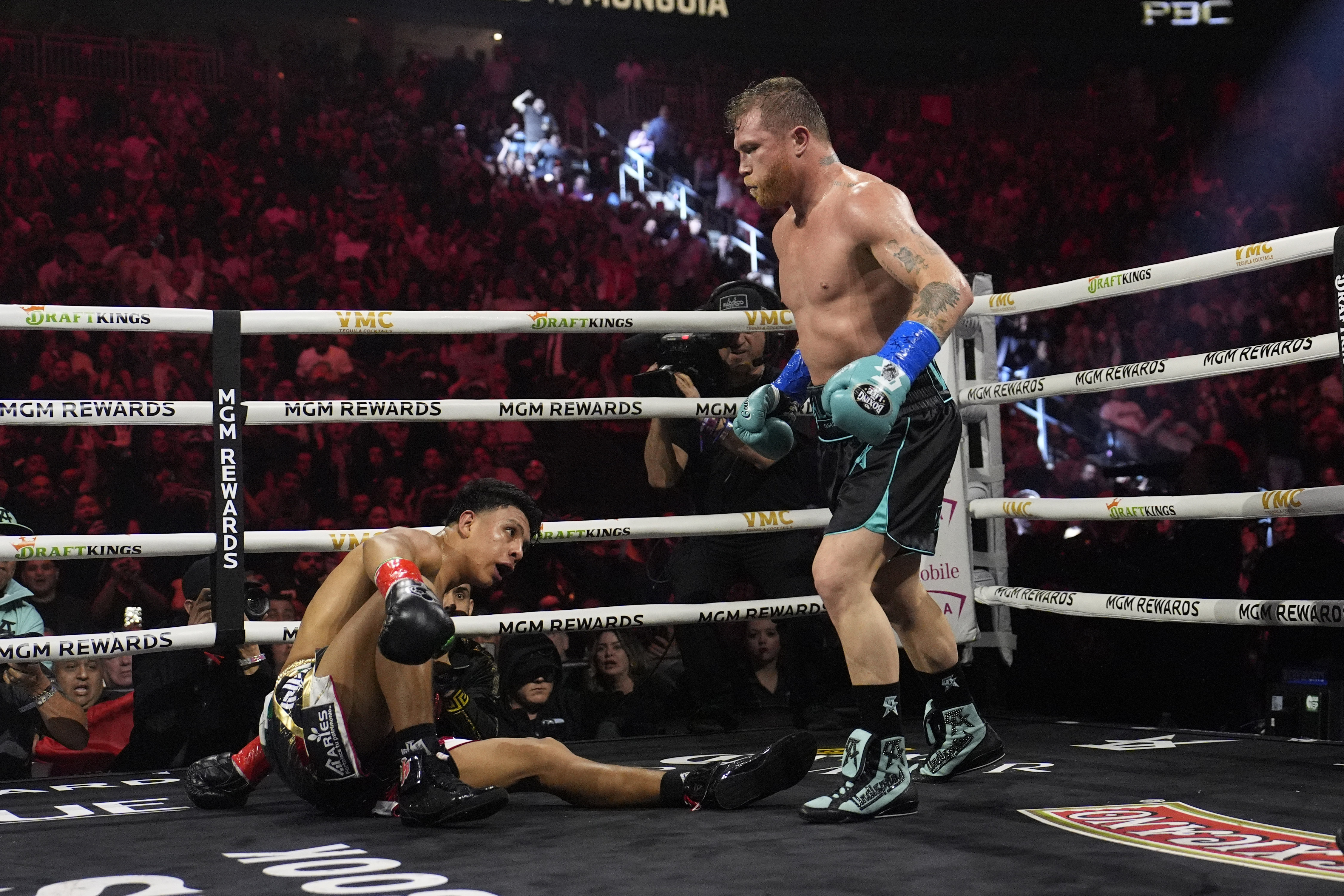 Canelo Alvarez knocks down Jaime Munguia in a super middleweight title fight Saturday, May 4, 2024, in Las Vegas.