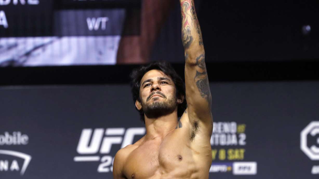 FILE - Alexandre Pantoja poses on the scale during a ceremonial weigh-in for the UFC 290 mixed martial arts event July 7, 2023, in Las Vegas. Flyweight champion Pantoja is scheduled to meet Steve Erceg in the main event at UFC 301 in Rio de Janeiro, Saturday, May 4, 2024.