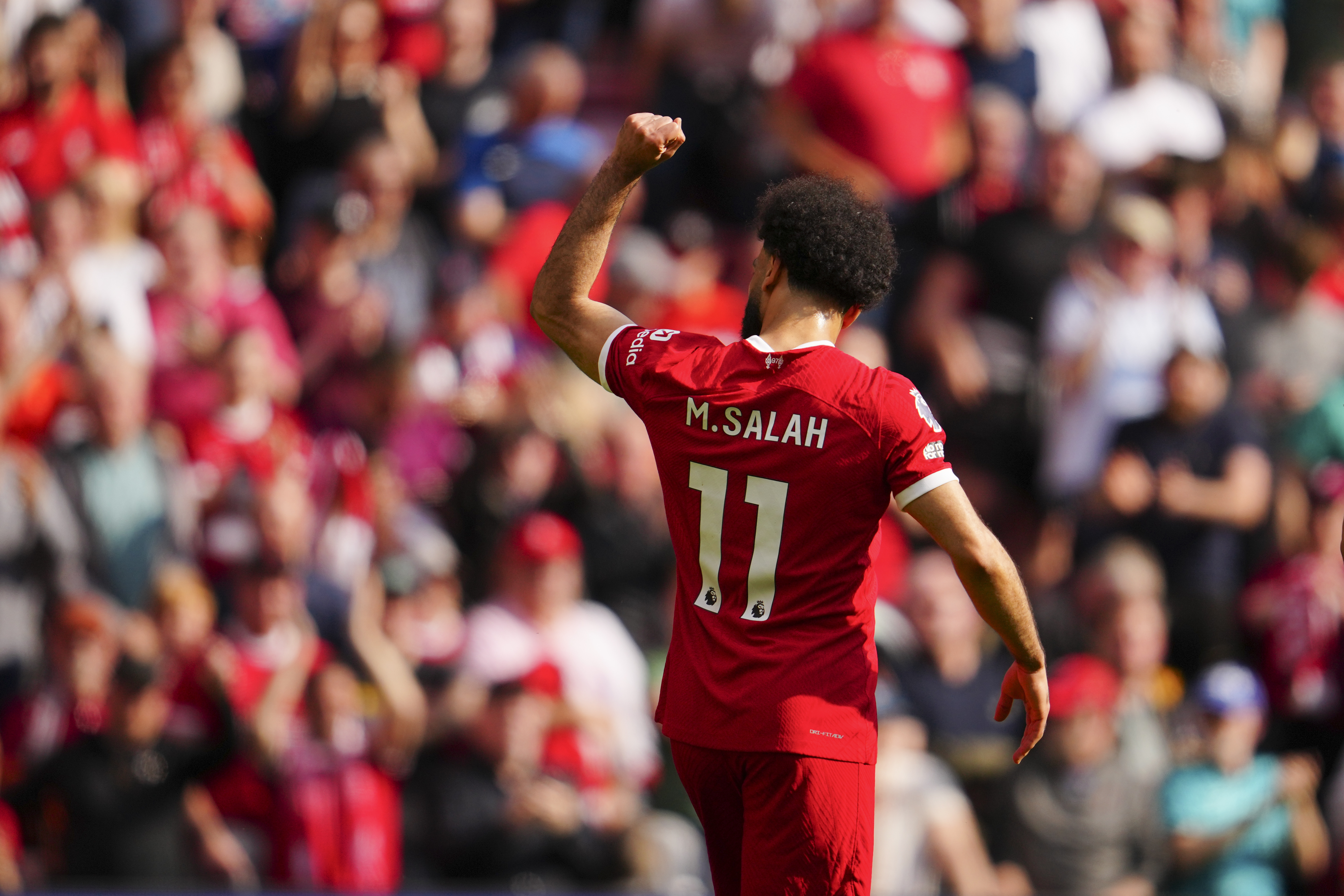 Liverpool's Mohamed Salah celebrates scoring his side's opening goal during the English Premier League soccer match between Liverpool and Tottenham Hotspur at Anfield Stadium in Liverpool, England, Sunday, May 5, 2024.