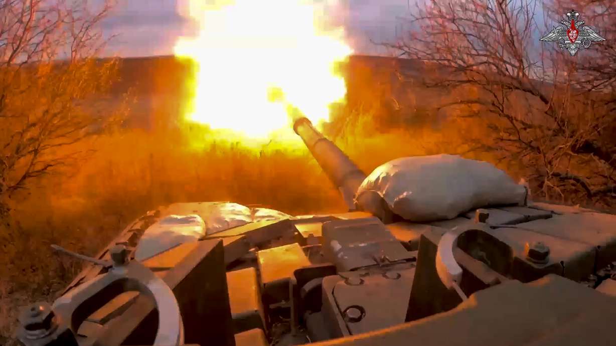 A Russian tank fires at Ukrainian troops from a position near the border with Ukraine in Russia’s Belgorod region in a photo released March 19. Russia's Defense Ministry says it plans to hold drills simulating the use of battlefield nuclear weapons.